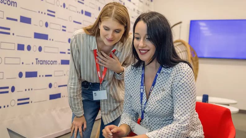 two girls looking in laptop